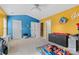 Bright bedroom with a ceiling fan, playful wall colors, and ample space for creativity and fun at 14139 Winford Ln, Charlotte, NC 28262