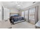 Bright bedroom featuring neutral walls, plush carpeting, and a large window with natural light at 14139 Winford Ln, Charlotte, NC 28262