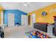 Bright bedroom with a ceiling fan, playful wall colors, and ample space for creativity and fun at 14139 Winford Ln, Charlotte, NC 28262