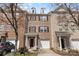 Beautiful brick townhome with a well-maintained front yard and an attached single-car garage at 14139 Winford Ln, Charlotte, NC 28262