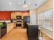 Stylish kitchen featuring stainless steel appliances, a central island, and hardwood flooring at 14139 Winford Ln, Charlotte, NC 28262