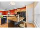 Stylish kitchen featuring stainless steel appliances, a central island, and hardwood flooring at 14139 Winford Ln, Charlotte, NC 28262