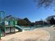 Community water park with slides, splash pads, and lounge chairs for Gathering fun at 14139 Winford Ln, Charlotte, NC 28262