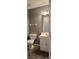 This bathroom features tile floors, a toilet, a sink, vanity, and a mirrored medicine cabinet at 14922 Rolling Sky Dr, Charlotte, NC 28273