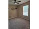 This is a carpeted room with decorations and a ceiling fan at 14922 Rolling Sky Dr, Charlotte, NC 28273