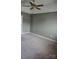 The carpeted bedroom includes a ceiling fan with lighting and neutral walls at 14922 Rolling Sky Dr, Charlotte, NC 28273