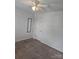 The carpeted bedroom has a ceiling fan with lighting and neutral colored walls at 14922 Rolling Sky Dr, Charlotte, NC 28273