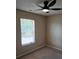 Cozy bedroom featuring neutral walls, carpet, a ceiling fan, and a window with blinds at 14922 Rolling Sky Dr, Charlotte, NC 28273