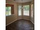 Sunlit dining area with large windows and tile flooring at 14922 Rolling Sky Dr, Charlotte, NC 28273