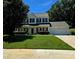 Charming two-story home with black shutters, manicured lawn, and attached two car garage at 14922 Rolling Sky Dr, Charlotte, NC 28273