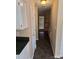 Hallway with tile flooring, white doors, and access to other rooms at 14922 Rolling Sky Dr, Charlotte, NC 28273