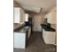 Kitchen featuring white cabinets, stainless steel appliances, and ample counter space at 14922 Rolling Sky Dr, Charlotte, NC 28273