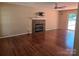 Inviting living room with a stone fireplace, ceiling fan, and natural light at 14922 Rolling Sky Dr, Charlotte, NC 28273