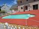 Enjoy a refreshing dip in the pool, surrounded by a spacious red patio at 14922 Rolling Sky Dr, Charlotte, NC 28273