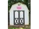 Well-maintained shed features sturdy doors, making it perfect for secure storage with cute 'Very Awesome' decor at 14922 Rolling Sky Dr, Charlotte, NC 28273