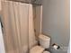 Bathroom featuring a tub/shower combo with white shower curtain and toilet at 1509 Tiana Way, Rock Hill, SC 29732