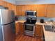 Modern kitchen featuring stainless steel appliances, light wood cabinets and a sleek design for easy meal preparation at 1509 Tiana Way, Rock Hill, SC 29732