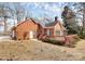 Brick house with a large wooden deck, screened in porch, and a well maintained backyard at 1531 Wheaton Nw Way, Concord, NC 28027