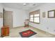 Bright bedroom featuring neutral walls, a ceiling fan, a rocking chair, and vintage-style area rug at 1531 Wheaton Nw Way, Concord, NC 28027