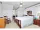 Bedroom showcasing a wooden-frame bed, ceiling fan, neutral walls and two side tables at 1531 Wheaton Nw Way, Concord, NC 28027