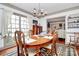 Bright dining room with large window and hardwood floors at 1531 Wheaton Nw Way, Concord, NC 28027