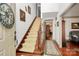 Grand foyer with staircase, hardwood floors, and neutral paint at 1531 Wheaton Nw Way, Concord, NC 28027