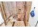 Tiled shower featuring a built-in shelf, a shower head and a handheld shower head at 1531 Wheaton Nw Way, Concord, NC 28027