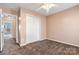 Neutral bedroom with carpeting, ceiling fan and white closet doors at 17847 Caldwell Track Dr, Cornelius, NC 28031