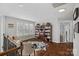 Bright bonus room with hardwood floors, built-in bookcase and large window at 18334 Dembridge Dr, Davidson, NC 28036