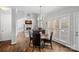 Dining area with hardwood floors, fireplace, and large windows at 18334 Dembridge Dr, Davidson, NC 28036