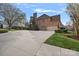 Spacious three-car garage with a wide driveway and lush, green landscaping at 18334 Dembridge Dr, Davidson, NC 28036