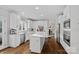 Bright kitchen featuring an island with marble countertops and stainless steel appliances at 18334 Dembridge Dr, Davidson, NC 28036