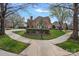 Beautiful home exterior framed by a landscaped lawn and sidewalk at the corner of an intersection at 18334 Dembridge Dr, Davidson, NC 28036