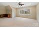 Large bonus room with a built-in desk, window, and neutral carpet at 1838 Landry Ln, Rock Hill, SC 29732