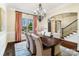 Formal dining room with chandelier, large window, and elegant furnishings at 1838 Landry Ln, Rock Hill, SC 29732