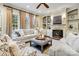 Cozy living room with fireplace, built-in shelves, and large windows for natural light at 1838 Landry Ln, Rock Hill, SC 29732