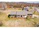 An aerial view of a single Gathering home with a large backyard at 19 Harolds Ct, Taylorsville, NC 28681