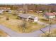 Aerial view of a home with brick exterior, attached garage, and a well-maintained lawn at 19 Harolds Ct, Taylorsville, NC 28681