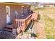 An elevated view of the backyard deck, showing the brick exterior of the house and the surrounding yard at 19 Harolds Ct, Taylorsville, NC 28681