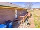 Backyard featuring a wooden deck, brick siding, and a peaceful outdoor setting at 19 Harolds Ct, Taylorsville, NC 28681