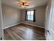 Inviting bedroom features vinyl floors, natural light from the window, and neutral paint at 19 Harolds Ct, Taylorsville, NC 28681