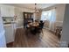 Cozy dining area featuring warm wood floors and stylish chandelier at 19 Harolds Ct, Taylorsville, NC 28681