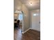 Inviting entryway showcasing the front door and archway into the dining area with hardwood floors at 19 Harolds Ct, Taylorsville, NC 28681