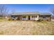 Single-story home with brick accents, shutters, and an inviting front porch at 19 Harolds Ct, Taylorsville, NC 28681