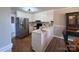 Bright kitchen featuring white cabinets, modern appliances, and a functional breakfast bar at 19 Harolds Ct, Taylorsville, NC 28681