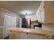 Functional kitchen featuring stainless steel appliances, white cabinets, and a breakfast bar at 19 Harolds Ct, Taylorsville, NC 28681