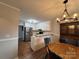 Kitchen and dining area showcasing white cabinets and stainless steel refrigerator at 19 Harolds Ct, Taylorsville, NC 28681