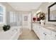 Well-lit bathroom with a soaking tub, separate shower, and double vanity, offering a spa-like experience at 2018 Links View Dr, Fort Mill, SC 29707