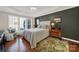 Calming bedroom with hardwood floors, tray ceiling, and plantation shutters, designed for rest and relaxation at 2018 Links View Dr, Fort Mill, SC 29707