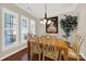 Bright dining room with wooden table set and plantation shutters on the window at 2018 Links View Dr, Fort Mill, SC 29707